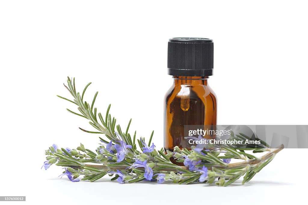 Essential Oil with Sprigs of Fresh Rosemary