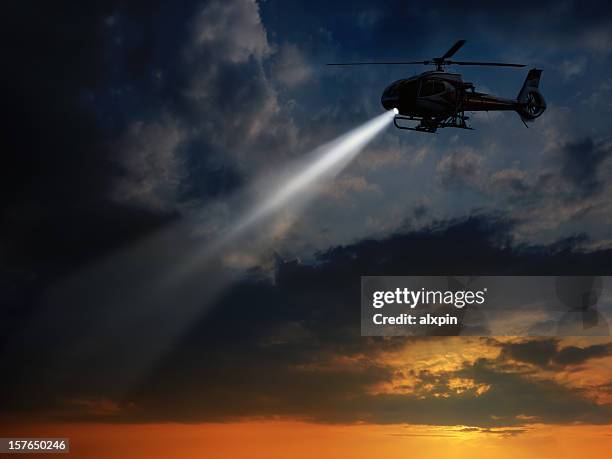 helicopter in dusk - helikopter stockfoto's en -beelden