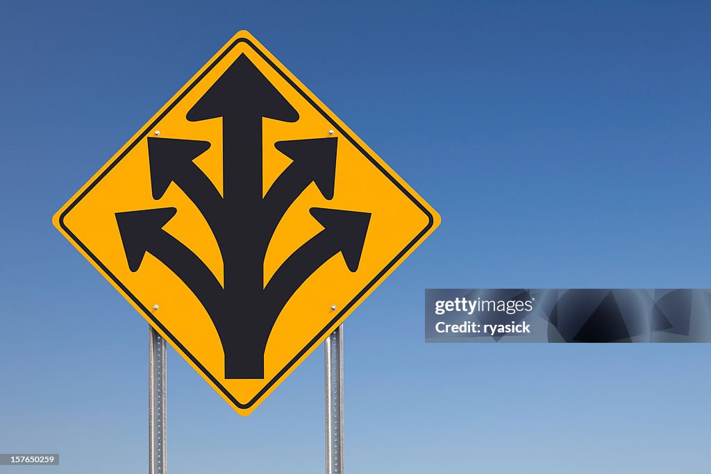 Division Ahead or Branching Out Traffic Sign Post Over Sky