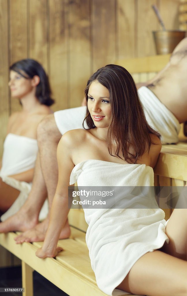 Young girls and boy enjoying sauna