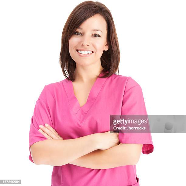 freundliche junge krankenschwester in pink peelings - nurse and portrait and white background and smiling and female and looking at camera stock-fotos und bilder