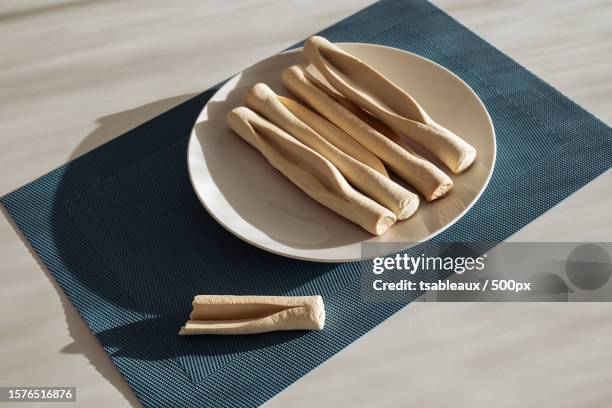 high angle view of eating utensils on table - backery fotografías e imágenes de stock