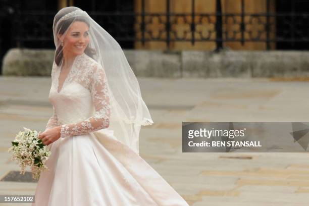 Kate Middleton smiles as she arrives at the West Door of Westminster Abbey in London for her wedding to Britain's Prince William, on April 29, 2011....
