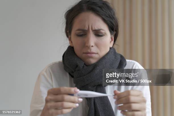 woman holding pregnancy test - altitude sickness stock pictures, royalty-free photos & images