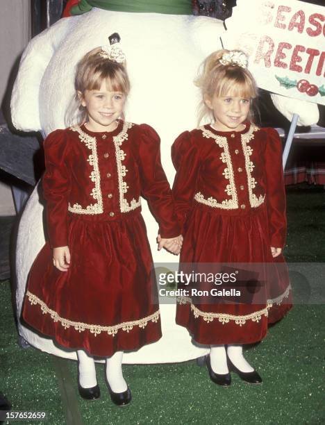 Actress Mary-Kate and Ashley Olsen attend the 60th Annual Hollywood Christmas Parade on December 1, 1991 at KTLA Studios in Hollywood, California.