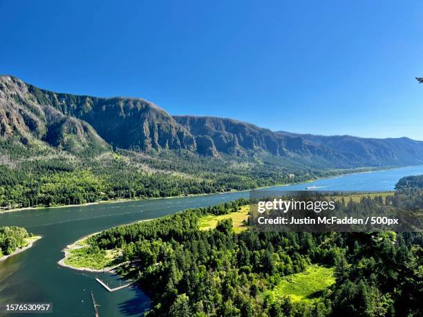 scenic view of lake and mountains against clear blue sky,skamania county,washington,united states,usa - blue mountains washington stock pictures, royalty-free photos & images