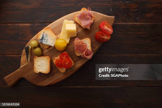 cheese and ham canapes with christmas decoration - christmas party canapes stock pictures, royalty-free photos & images