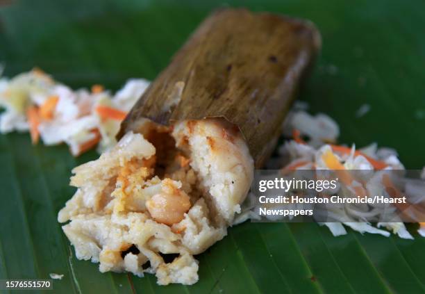 Chicken Tamale wrapped in a banana leaf featured at Pupuseria Y Panaderia Emanuel on Tuesday, April 30 in Houston.