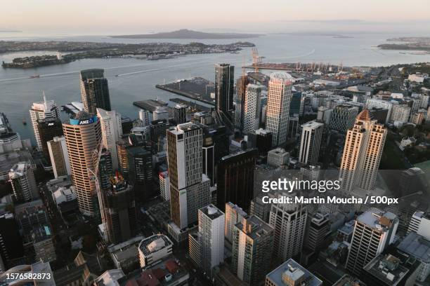 aerial view of modern buildings in city against sky - auckland city busy stockfoto's en -beelden