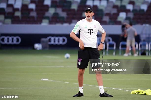 Thomas Tuchel of Bayern Muenchen looks on during the Bayern Muenchen press conference and training session at National Stadium on July 28, 2023 in...