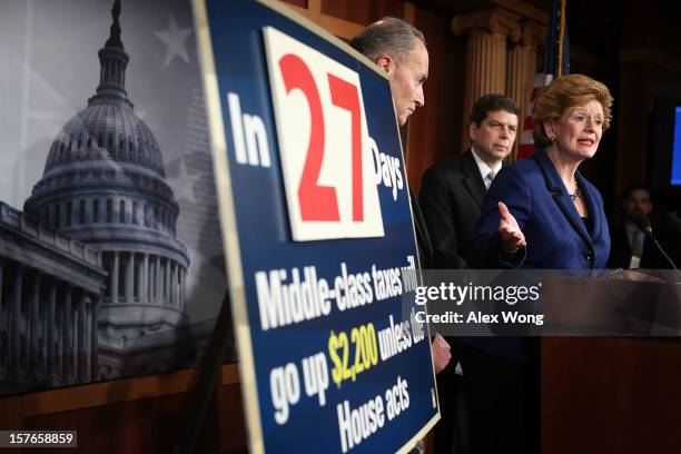 Sen. Debbie Stabenow speaks as Sen. Charles Schumer and Sen. Mark Begich listen during a news conference December 5, 2012 on Capitol Hill in...
