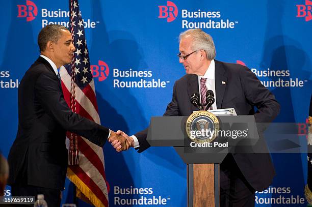 President Barack Obama shakes hands with Chair of the Business Roundtable Boeing CEO Jim McNerney prior to delivering remarks to members of the...