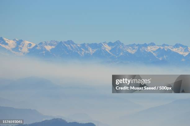 scenic view of snowcapped mountains against clear sky - muaaz stock pictures, royalty-free photos & images