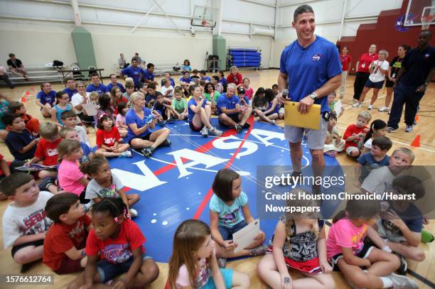 Astronauts Mike Hopkins encourages campers to stay fit during summer camp at Johnson Space Center on Wednesday, July 17 in Houston.