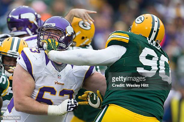 Brandon Fusco of the Minnesota Vikings blocks B.J. Raji of the Green Bay Packers at Lambeau Field on December 2, 2012 in Green Bay, Wisconsin. The...