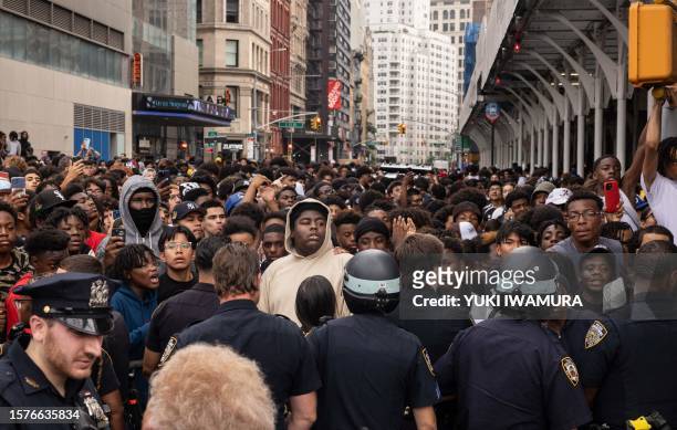 Police officers control the crowd during riots sparked by Twitch streamer Kai Cenat, who announced a "givaway" event, in New York's Union Square on...