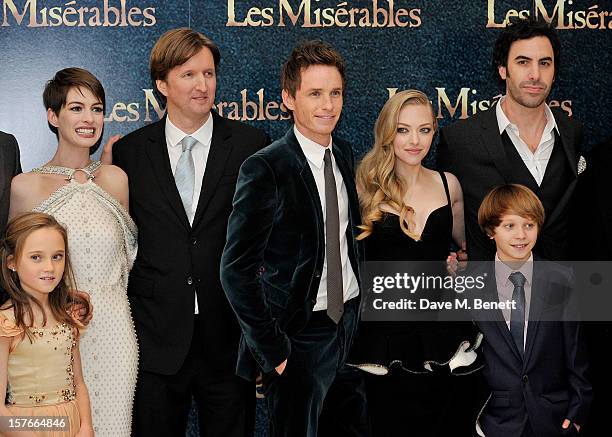 Isabelle Allen, Anne Hathaway, Tom Hooper, Eddie Redmayne, Amanda Seyfried, Daniel Huttlestone and Sacha Baron Cohen attend the World Premiere of...