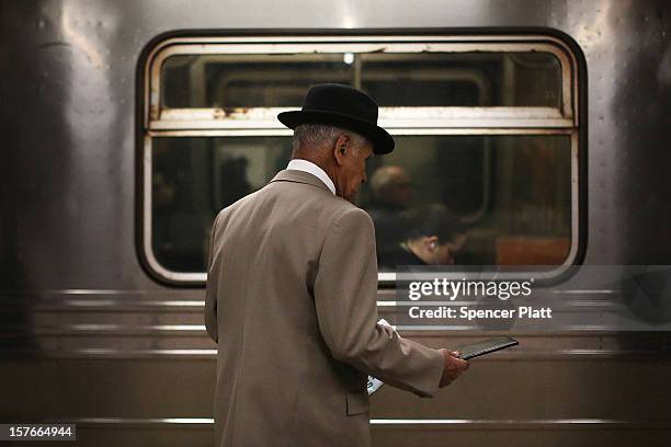 Man waits for the subway at a stop in Manhattan two days after a man was pushed to his death in front of a train on December 5, 2012 in New York...