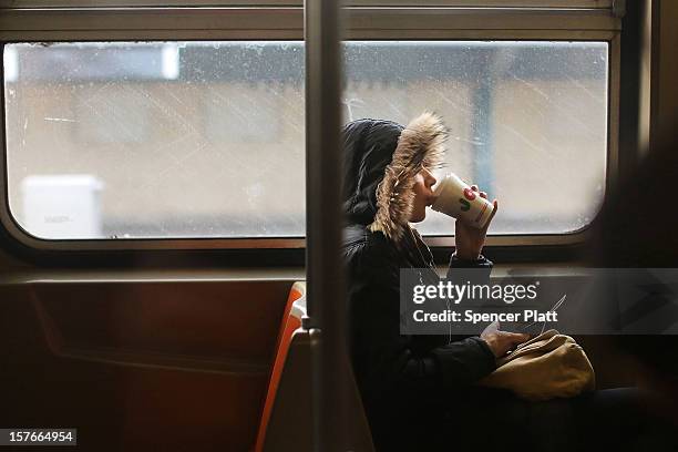 Passenger rides in a subway car two days after a man was pushed to his death in front of a train on December 5, 2012 in New York City. The incident...