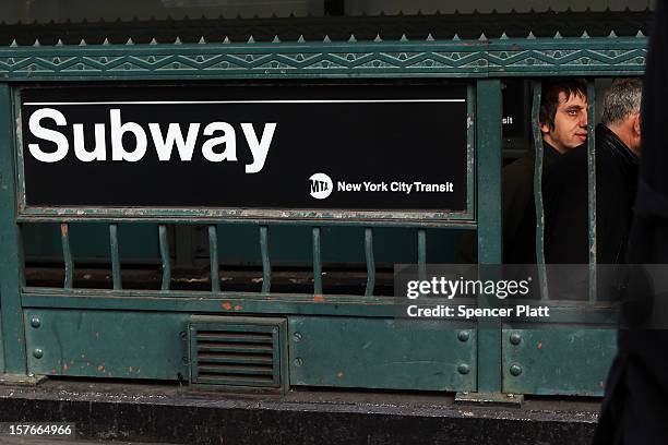 People exit a subway stop in Manhattan two days after a man was pushed to his death in front of a train on December 5, 2012 in New York City. The...