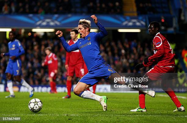 Fernando Torres of Chelsea gooes down following contact with Enoch Adu FC Nordsjaelland during the UEFA Champions League group E match between...