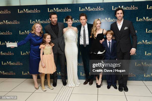 Isabelle Allen, Hugh Jackman, Anne Hathaway, Eddie Redmayne, Amanda Seyfried and Sacha Baron Cohen attend the world premiere of Les Miserables at The...