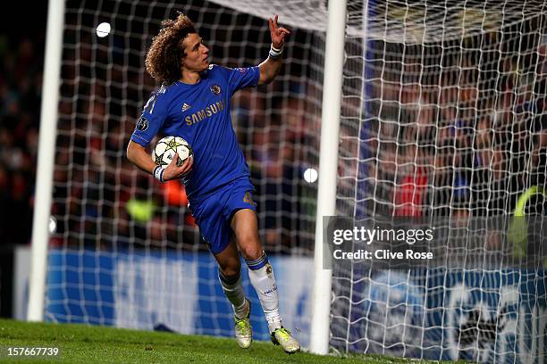 David Luiz of Chelsea celebrates after scoring the opening goal from the npenalty spot during the UEFA Champions League group E match between Chelsea...