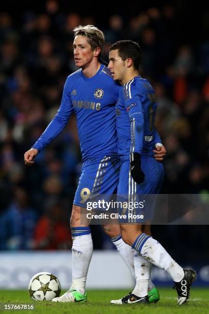 Fernando Torres of Chelsea is conratulated by teammate Eden Hazard after scoring his team's second goal during the UEFA Champions League group E...