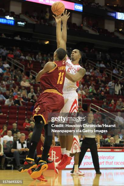 Cleveland Cavaliers power forward Tristan Thompson attempts to block Houston Rockets power forward Terrence Jones as he scores during the first...