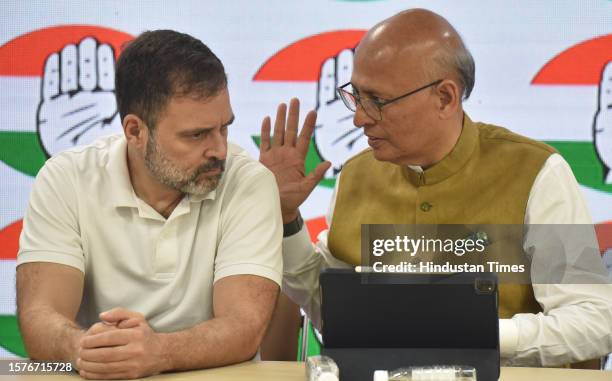 Congress leader Rahul Gandhi talking with Dr Abhishek Manu Singhvi and other Leaders addressing a Press conferance after the Supreme Court stayed his...