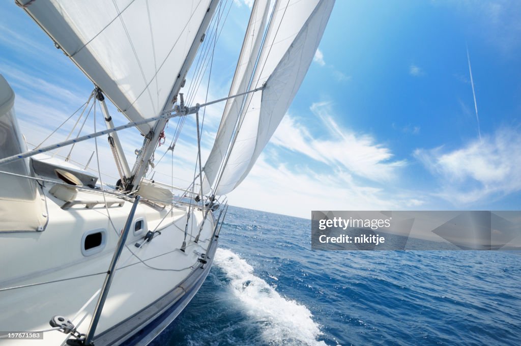 Yacht under sail on the sunny day