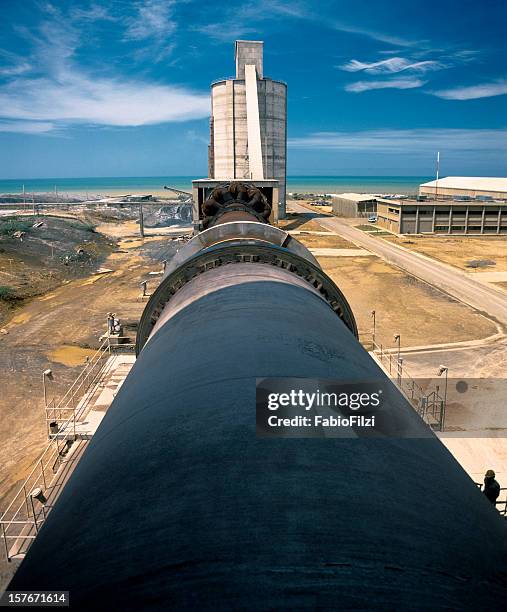 cement factory near the sea - fabio filzi stock pictures, royalty-free photos & images