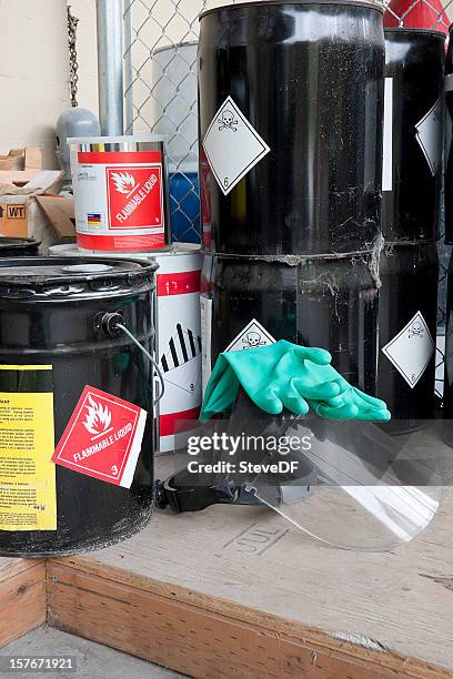 drums and containers of poisonous and flammable substances - hazardous substances stock pictures, royalty-free photos & images