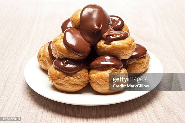 profiteroles - choux pastry stock pictures, royalty-free photos & images