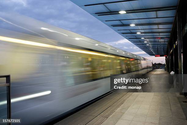 driving metro and station at night in copenhagen - copenhagen metro stock pictures, royalty-free photos & images