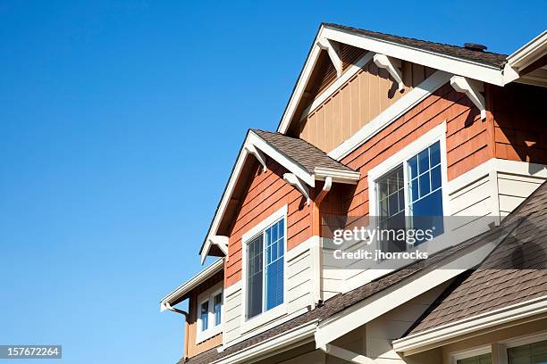 rooftop against clear blue sky - low angle view home stock pictures, royalty-free photos & images