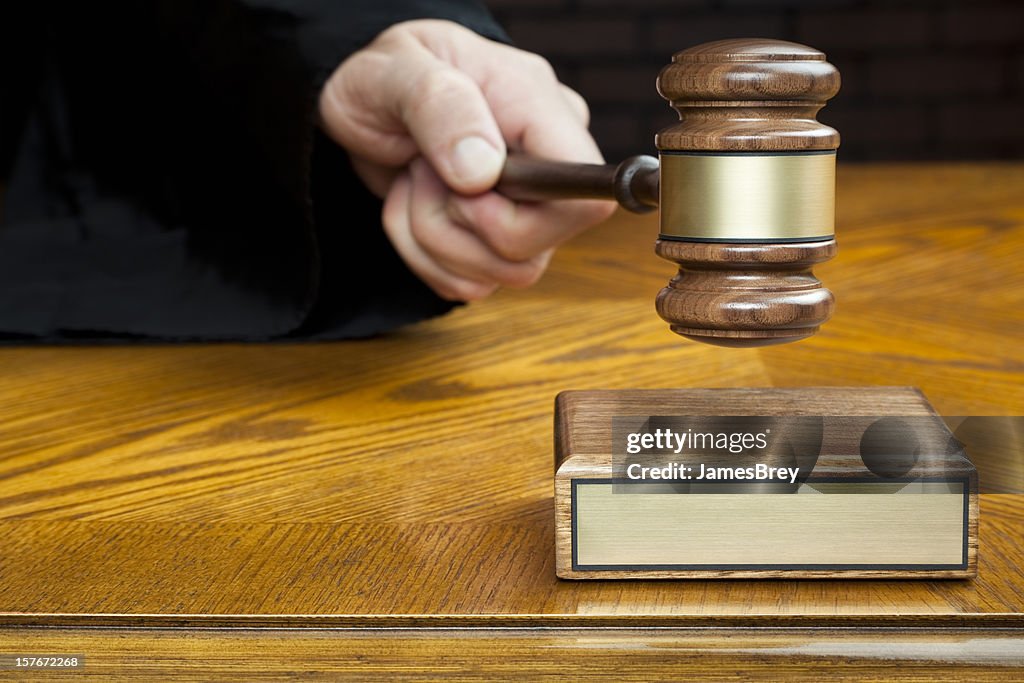 Justice's Hand Pounds Gavel to Block With Blank Plaque