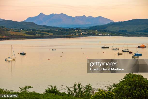 view of loch portree and mountains of the isle of raasay - raasay stock pictures, royalty-free photos & images