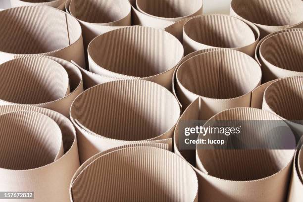 corrugated cardboard rolls from high angle view - rolled up stockfoto's en -beelden