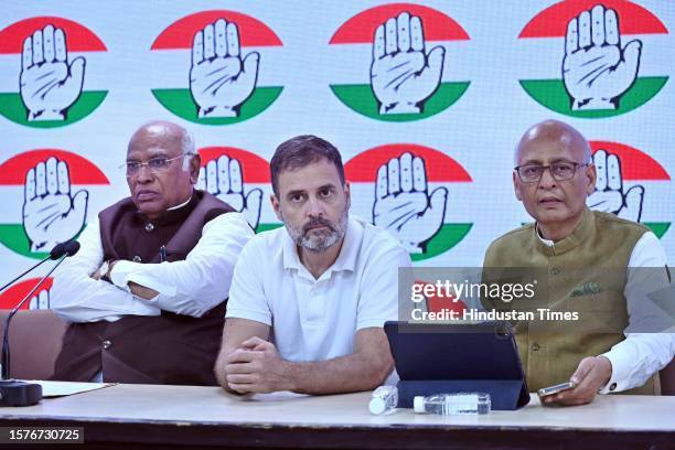 Congress President Mallikarjun Kharge with party leader Rahul Gandhi at AICC headquarters during press conference after the Supreme Court stayed...