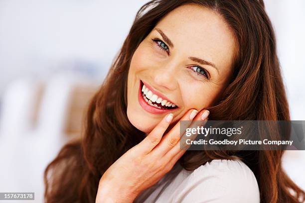 cheerful mature female with hand on chin - beautiful women stock pictures, royalty-free photos & images