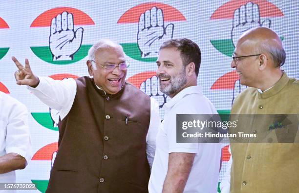 Congress President Mallikarjun Kharge with party leader Rahul Gandhi at AICC headquarters during press conference after the Supreme Court stayed...