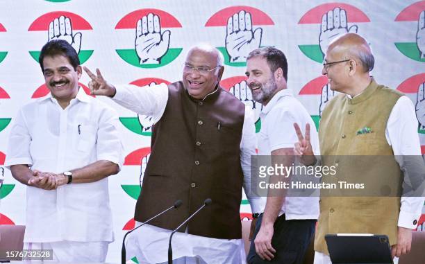 Congress President Mallikarjun Kharge with party leader Rahul Gandhi at AICC headquarters during press conference after the Supreme Court stayed...