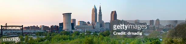 cleveland cityscape over cuyahoga river panorama - cleveland ohio stock pictures, royalty-free photos & images