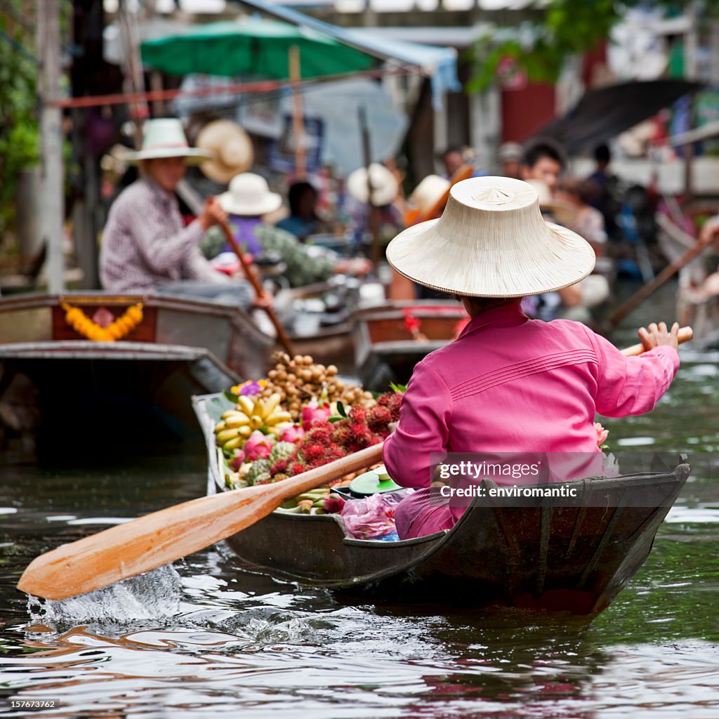 Fruit vendor at a floating market in Thailand