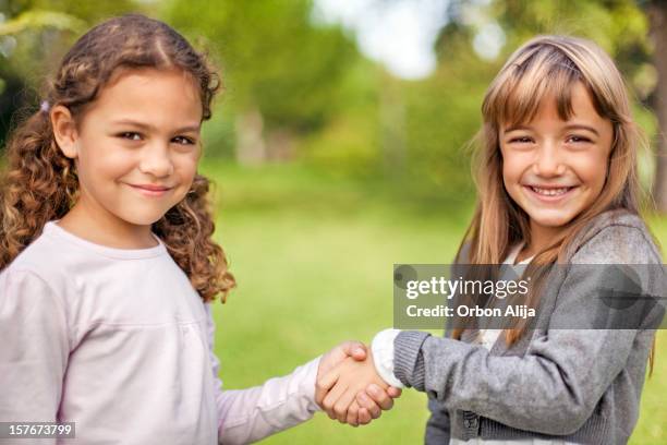 friends - extending the hand of friendship stock pictures, royalty-free photos & images