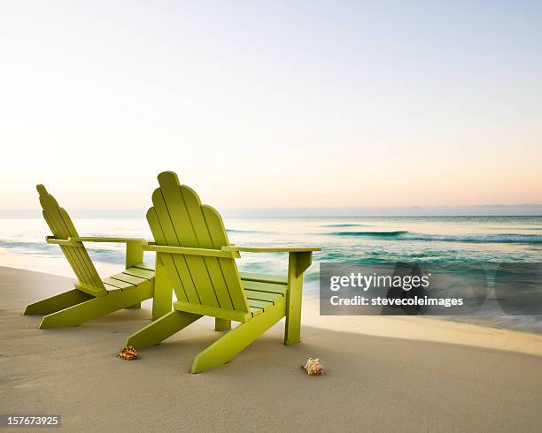 adirondack chairs on beach - adirondack chair stockfoto's en -beelden