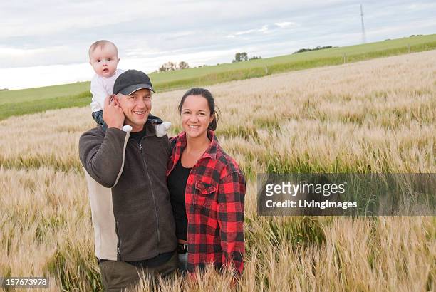 young farming family - blue collar family stock pictures, royalty-free photos & images