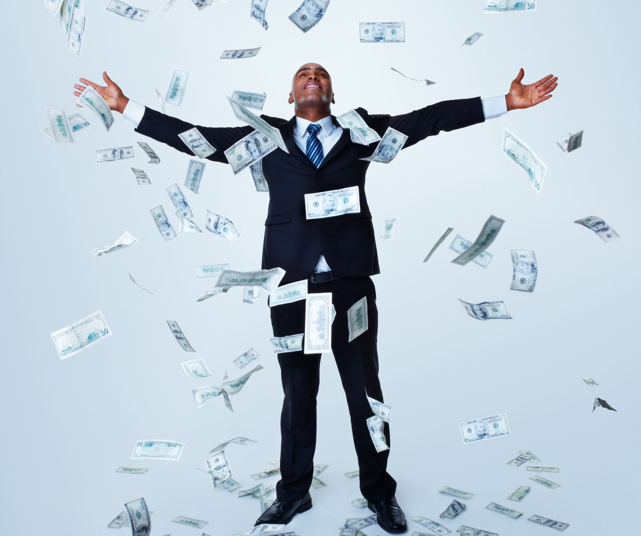 Happy successful business man under money rain against white Happy successful business man under money rain against white