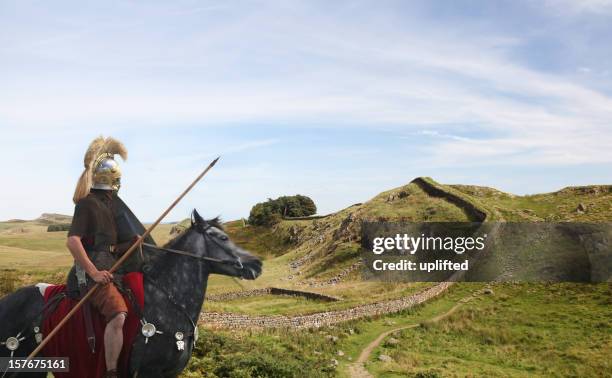 roman soldier guarding hadrians wall - army in scotland stock pictures, royalty-free photos & images